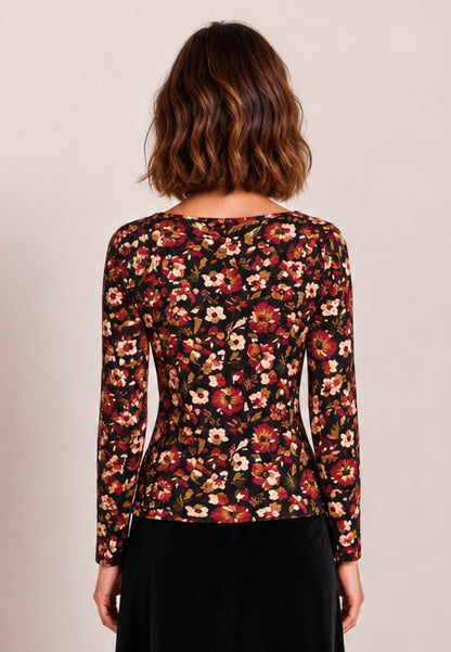 Shirt, Modell Alice mit buntem Blumenmuster an Frau in Rückenansicht und schwarzer Hose