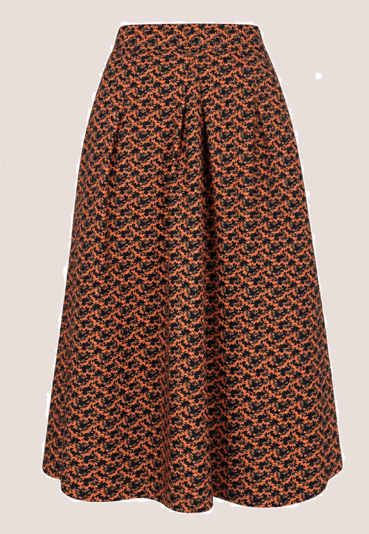 Rock, Modell Elsa mit orange-schwarzem Muster und ausgestellter Silhouette vor hellem Hintergrund